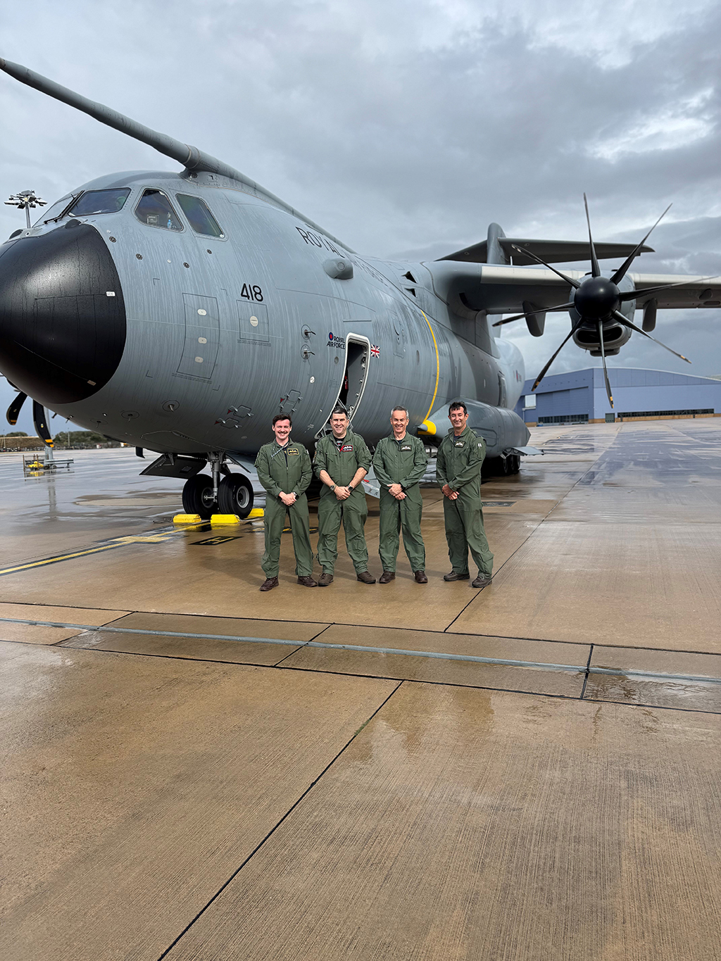 A group photo including Air Commodore Morgan, standing outside the Atlas (A400M) aircraft.